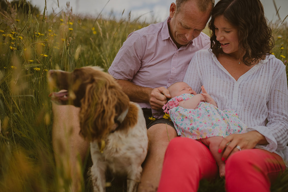 Couple holding their baby in Eureka