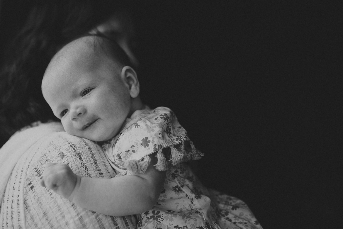 baby on mums shoulder