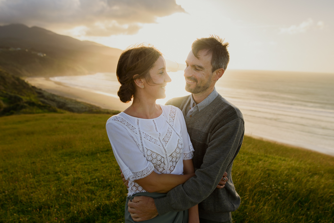 couple walking in raglan beach hills